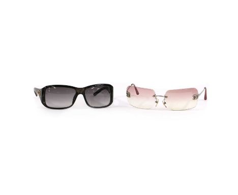 A pair of Gucci black framed sunglasses,with silver 'G' logo to the arms, cased, and a pair of Chanel sunglasses CC logo to f