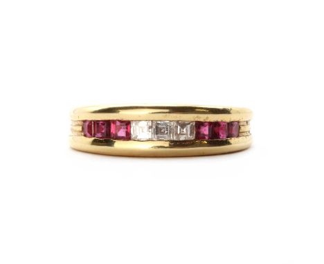 An 18ct gold diamond and ruby half eternity ring,square step cut diamonds, with square step cut rubies at each side, all chan