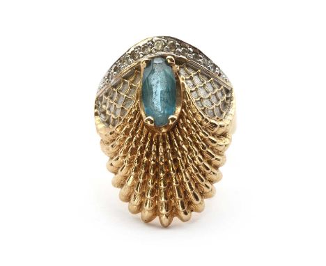 A gold aquamarine and diamond 'Luna' ring, by Erté, an oval mixed cut aquamarine, claw set to a scalloped fan above, with sca