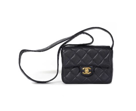 A Chanel navy caviar leather mini flap bag,single flat handle, gold tone hardware with interlocking CC closure, interior with