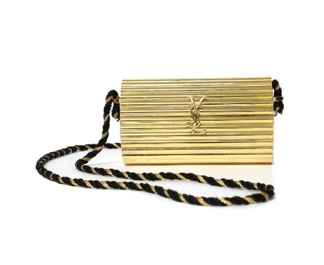 A Yves Saint Laurent Opium gilded metal shoulder bag,snap closure, twisted rope shoulder strap, 15cm wide, 6.5cm deep, 9cm hi