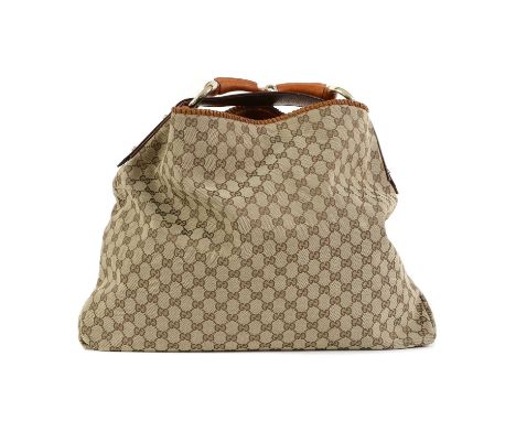 A Gucci canvas hobo bag,with leather strap and horse bit detailing, open to with interior zip pocket, serial number 114900 00