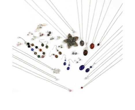 A collection of silver gem set jewellery,to include four cubic zirconia pendants and chains with matching earrings, a lapis l