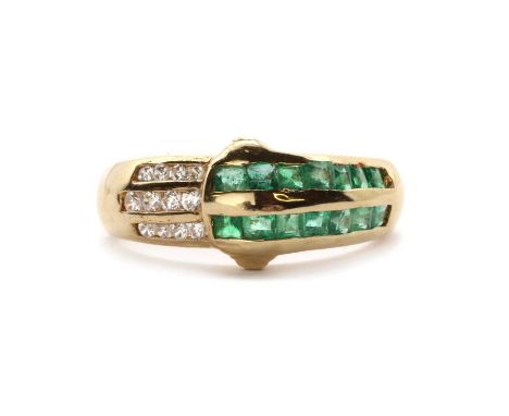 A gold emerald and cubic zirconia ring,of crossover form, the top half channel set with two rows of square step cut emeralds,