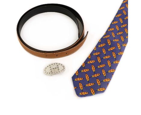 An Hermès black/ tan reversible belt,with silver tone oval detachable buckle, stamped 'Hermès Paris, Made in France, 95', dat