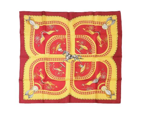 An Hermes carf, Voitures Paniers,Julia Abadie, 1984, red ground with gold detailing and carriages, equestrian scene, with ori
