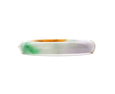 A 14ct gold mounted 'D' section jade hinged bangle, with concealed box clasp, Sheffield 2005, 37.41gCondition ReportMaker's m