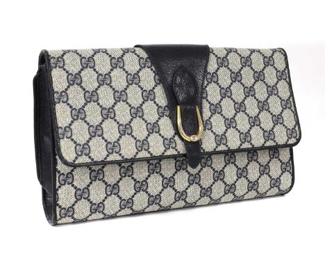 A vintage Gucci 'Accessory Collection' blue clutch,iconic double GG canvas exterior, magnetic stud closure opening to interio