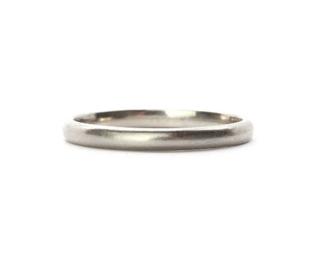 A platinum 'D' section wedding ring, marked PLAT, 2.10mm wide, 2.39g.Finger size KBuying this second-hand gemstone ring could