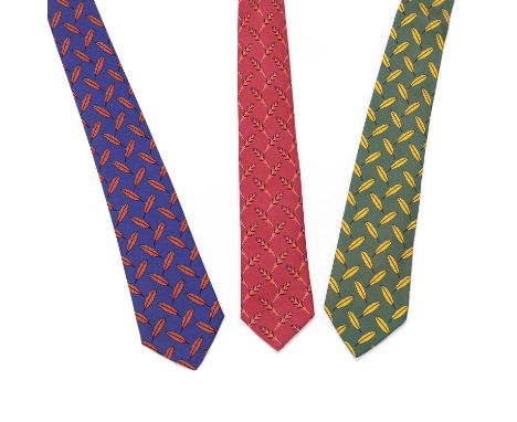 Three Hermès silk ties, 'Feathers', blue ground with red/ green feathers, red ground with red/ blue feathers, green ground wi