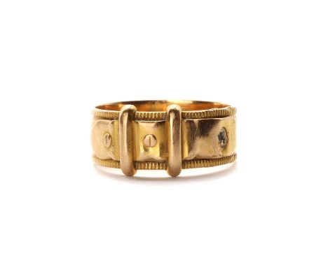 A Victorian 18ct gold buckle ring,with buckle detail to a flat section band with milled edges, Chester 1900, 6.60mm wide, 4.1