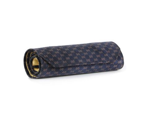 A Vintage Gucci blue suede jewellery roll,with GG logo, unravelling to a suede and leather interior, 22cm wideCondition Repor