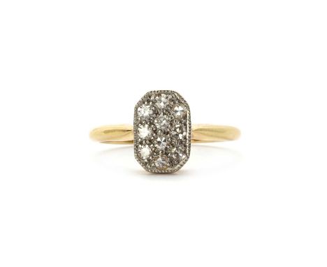 An early 20th century gold diamond set ring,an octagonal plaque head pavé set with eight cut diamonds, to solid tapered shoul