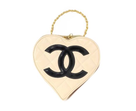 A Chanel pink leather heart bag,interlinked CC logo to front, gold tone hardware, rigid gold tone and interlinked leather han