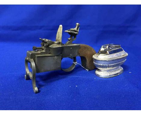 TWO CALIBRI GILT CASED LIGHTERSalong with a Dunhill tinder pistol novelty lighter and four others (7)