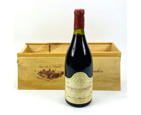 A cased 1500ml bottle of 1997 Gevrey- Chambertin red wine. Estimate £20-40.