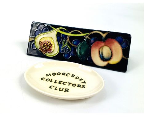 A Moorcroft pottery "Queens choice Toblerone" collectors plaque designed by Emma Bossons, signed to the underside (18cms wide