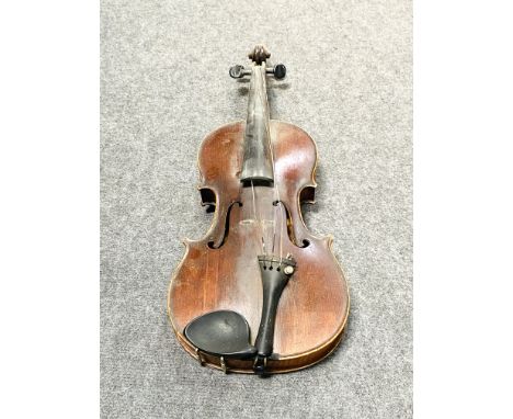 A cased violin with two bows. 60cms long x 21cms wide (Violin), complete with canvas carry bag. Estimate £20-40.