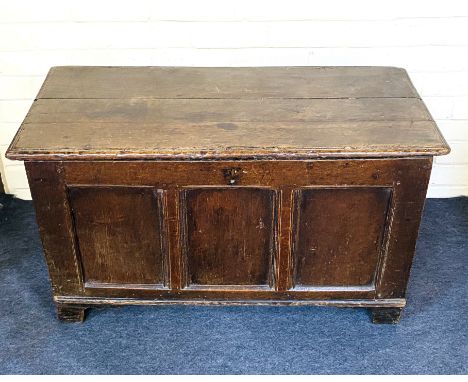 An early 18th century oak plank top coffer with a triple panelled front, of small proportions. 98cms wide x 46cms deep x 53cm