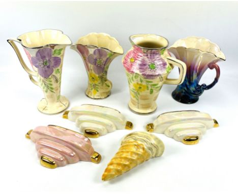A collection of eight early to mid 20th century ceramics to include a Beswick wall pocket, three lustre glaze Sadler Art Deco
