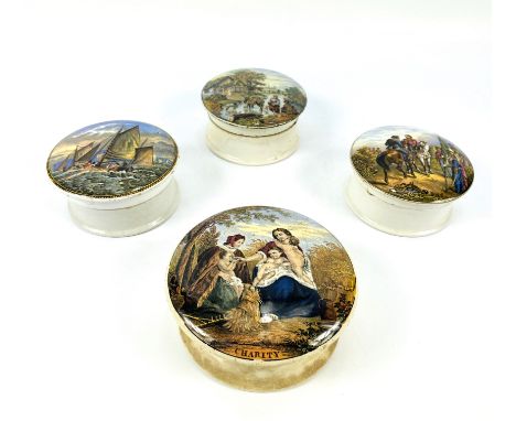 Four 19th century Prattware circular pot lids, largest 12.5cms diameter x 6cms high. Estimate £15-40.