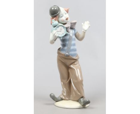 A Lladro figure of of clown holding an alarm clock.