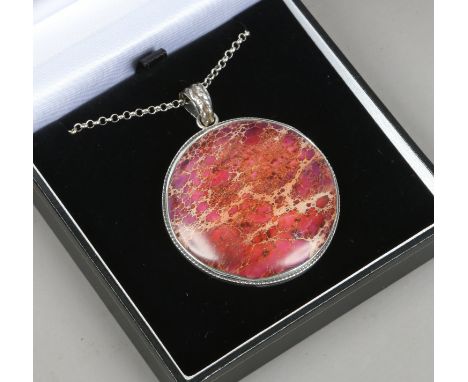 A silver mounted large agate roundel pendant on chain.