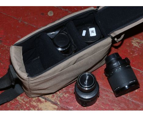 A camera bag and contents of 35mm Canon & Sigma lenses.