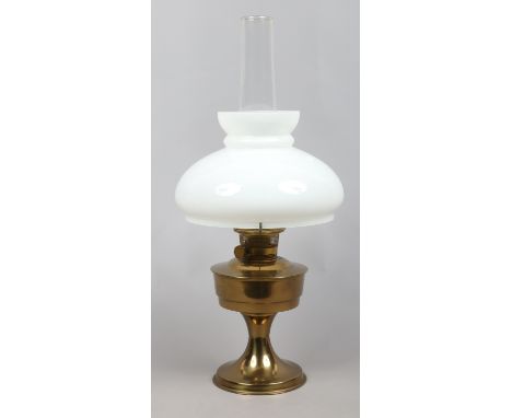 A brass based oil lamp with milchglas shade.