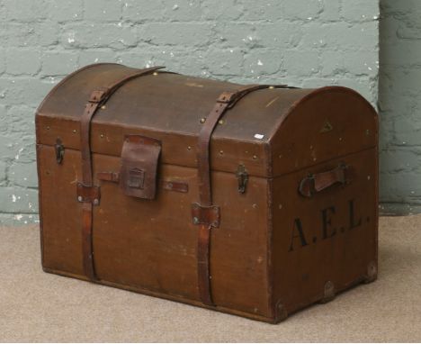 A vintage dome top leather and canvas travel trunk monogrammed A.E.L by G.G.Peterkin of Aberdeen.