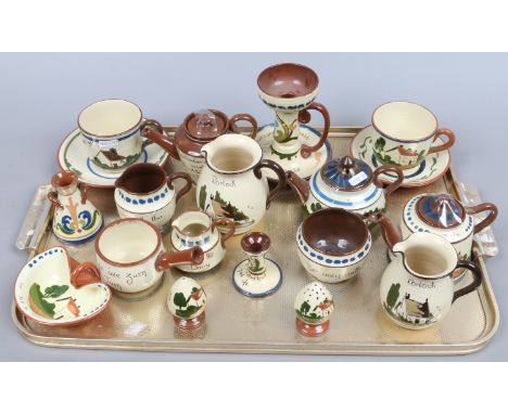 A collection of Torquay ware to include teapots, cups and saucers, jugs etc.