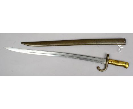 A C19th French sword bayonet with metal scabbard engraved to spine dated 1879.