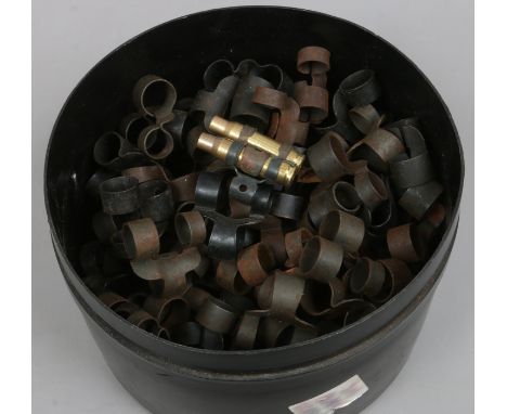 A tin of ammunition belt clips.