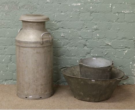 A vintage galvanized milk churn along with two galvanized buckets and a twin handled basin.