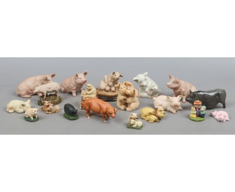 A collection of ceramic and composite models of pigs to include a Royal Doulton sow.