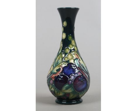 A Moorcroft pear shaped vase decorated with finches and berries design by Sally Tuffin first quality.