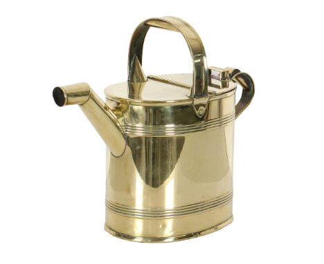 AN EDWARDIAN POLISHED BRASS WATERING CAN BY ARMY &amp; NAVY. stamped to underneath, 40cm high, 48cm wide. CR*  A few age rela
