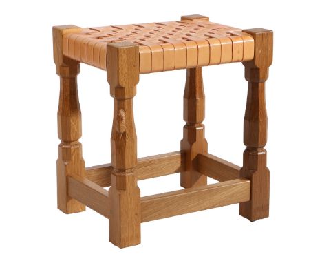 ROBERT MOUSEMAN THOMPSON (1876-1955): AN ENGLISH OAK AND LATTICE WORK STOOL. a carved oak joint stool with octagonal legs and