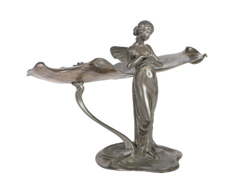 AN EARLY 20TH CENTURY WMF ART NOUVEAU SILVER PLATED COMPORT. cast as a lily-pad with winged maiden standing stroking a dove, 