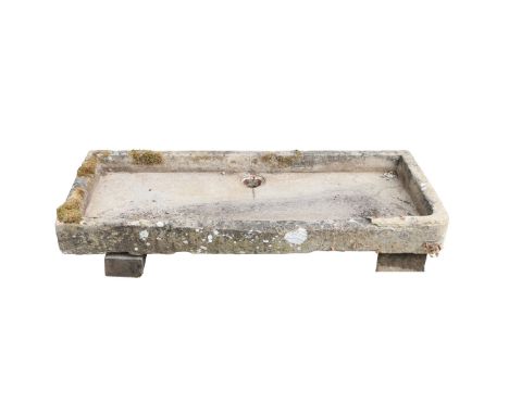 A SUBSTANTIAL 19TH CENTURY RECLAIMED HAND CARVED STONE TROUGH. the weathered hand carved stone trough, dating to the 19th cen