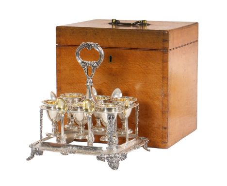 A FINE VICTORIAN SILVER SIX EGG CUP CRUET. by William Eaton, London 1839, the rectangular cruet frame, holding six detachable