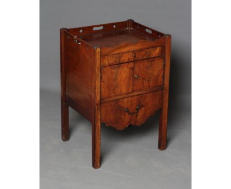 A GEORGIAN MAHOGANY BEDSIDE COMMODE, late 18th century, the part wave edged and pierced top over frieze drawer with a pair of