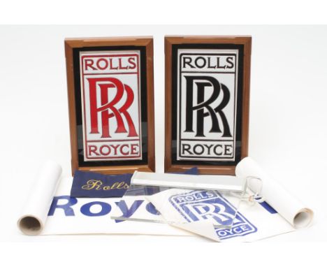 TWO FRAMED CERAMIC ROLLS ROYCE LOGOS, presumed to be part of a dealership's frontage, 15" x 9" each including frame, together