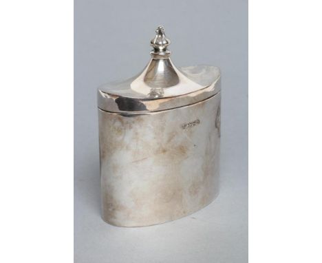 AN EDWARDIAN TEA CADDY, maker's mark J.D. & S., Sheffield 1909, of plain oval form, the hinged swept cover with bud finial, 3