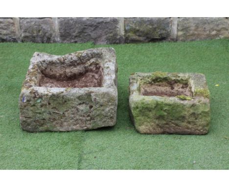 A SANDSTONE SMALL TROUGH of irregular rough hewn oblong form, 20" x 21" x 10", together with a similar item, 16 1/2" x 15" x 