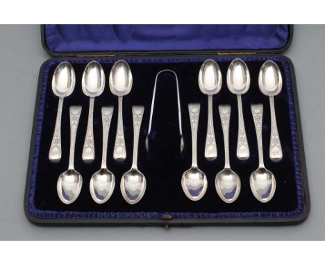 A SET OF TWELVE LATE VICTORIAN TEASPOONS, maker G M Jackson, London 1895, with bright cut engraving together with matching su