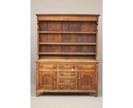 AN ANGLESEY OAK AND PARQUETRY DRESSER, mid 19th century, the boarded delft rack with moulded cornice and inlaid frieze over t