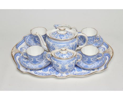 A ROYAL CROWN DERBY CHINA CABARET SET, 1896, printed in bright blue with finches perched upon scroll branches within a neo-cl