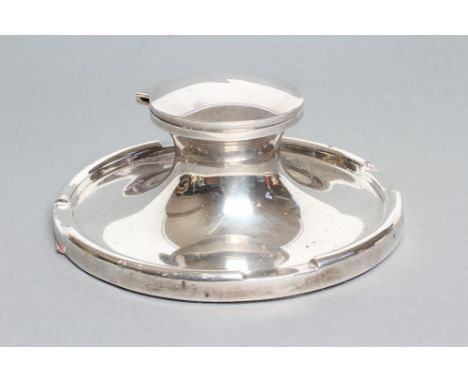 A LARGE CAPSTAN INKWELL, maker Zimmerman, Birmingham 1926, of typical form with hinged cover and clear glass well, loaded, 6 
