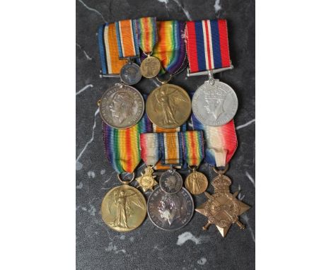 TWO GROUPS OF FIRST & SECOND WORLD WAR MEDALS AWARDED TO TWO FAMILY MEMBERS, comprising Victory Medal, British War Medal and 